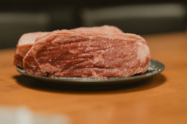 Raw whole brisket on cutting board ready for smoking preparation