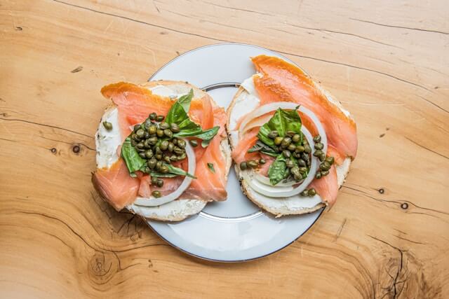 Smoked salmon on a bagel with cream cheese, capers, and dill